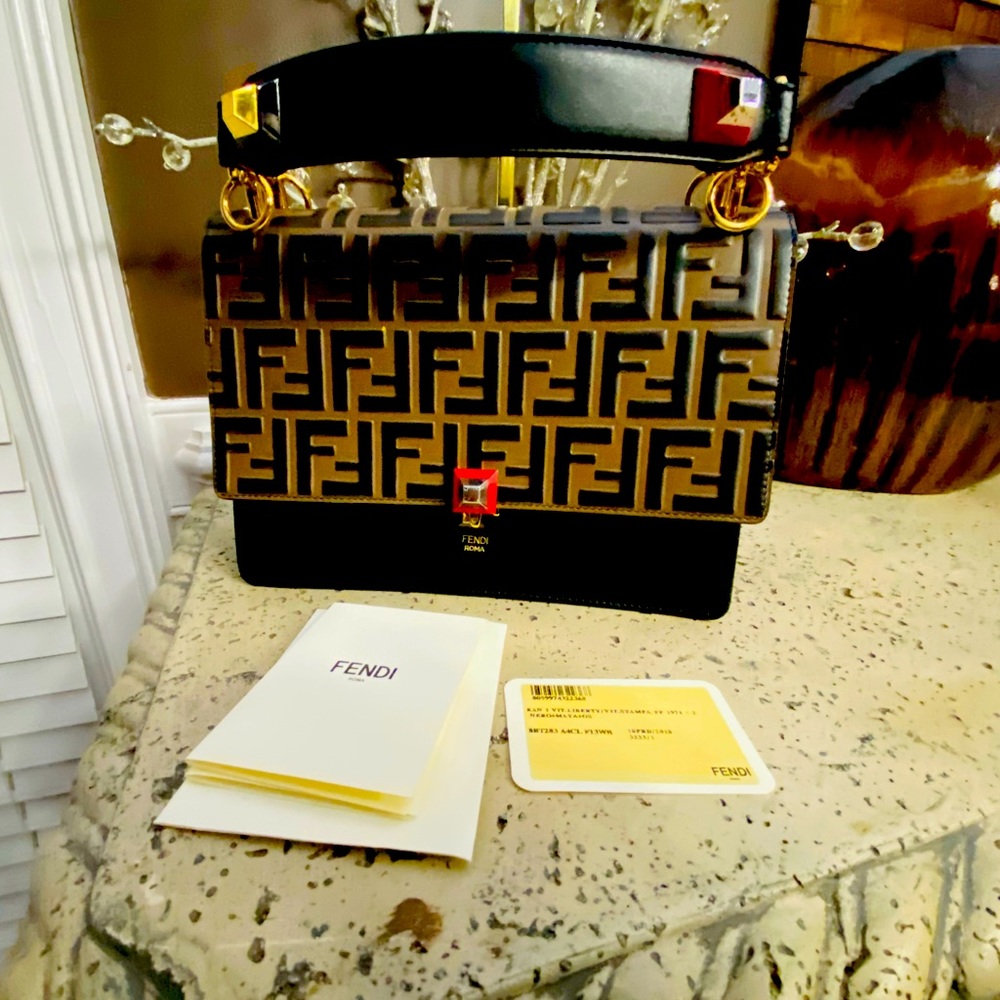 FENDI KANN BAG, still has plastic silver and gold on closures.
